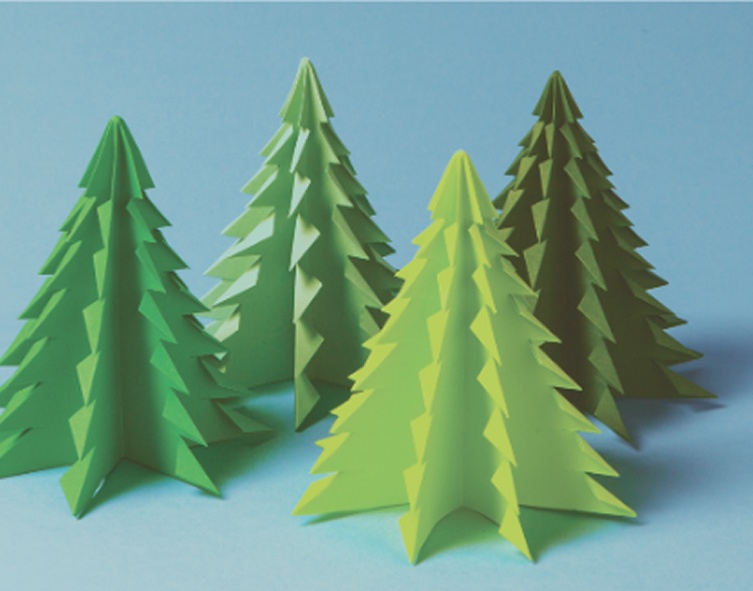 Colorful paper Christmas trees against a blue background, perfect for holiday decorations.