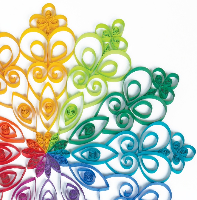 Colorful paper quilling art in floral designs and patterns.