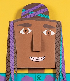 Colorful paper craft character with a happy expression and patterned hair.
